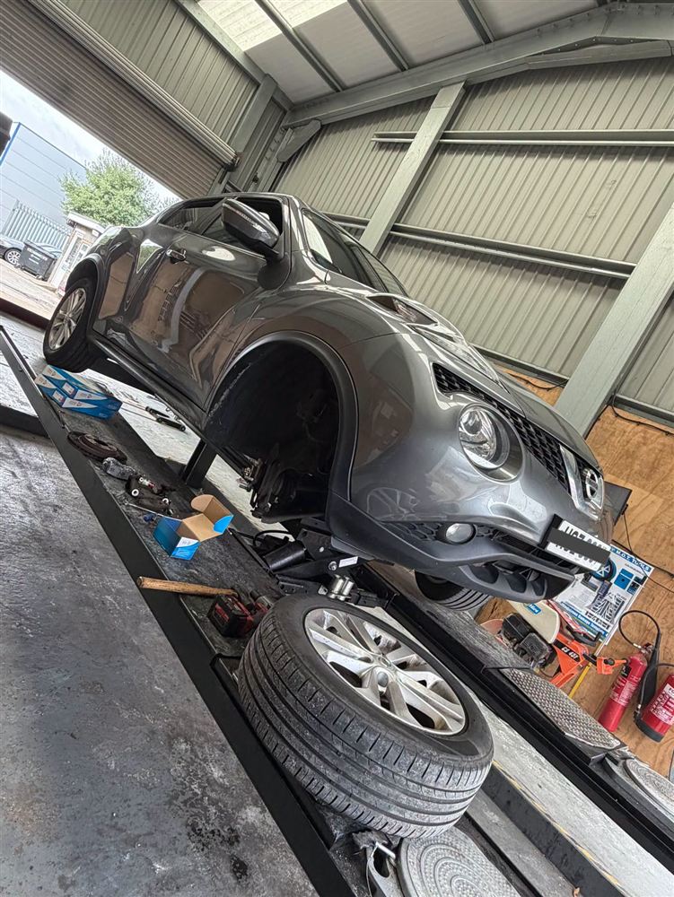 Car lifted with a wheel off