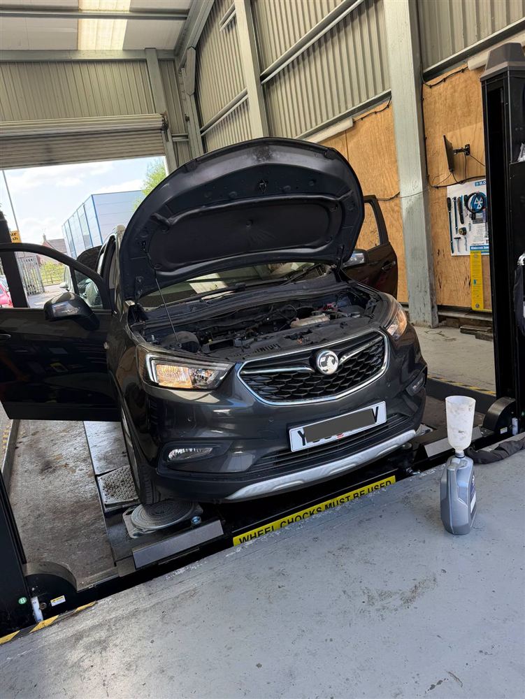 Grey Vauxhall in for work